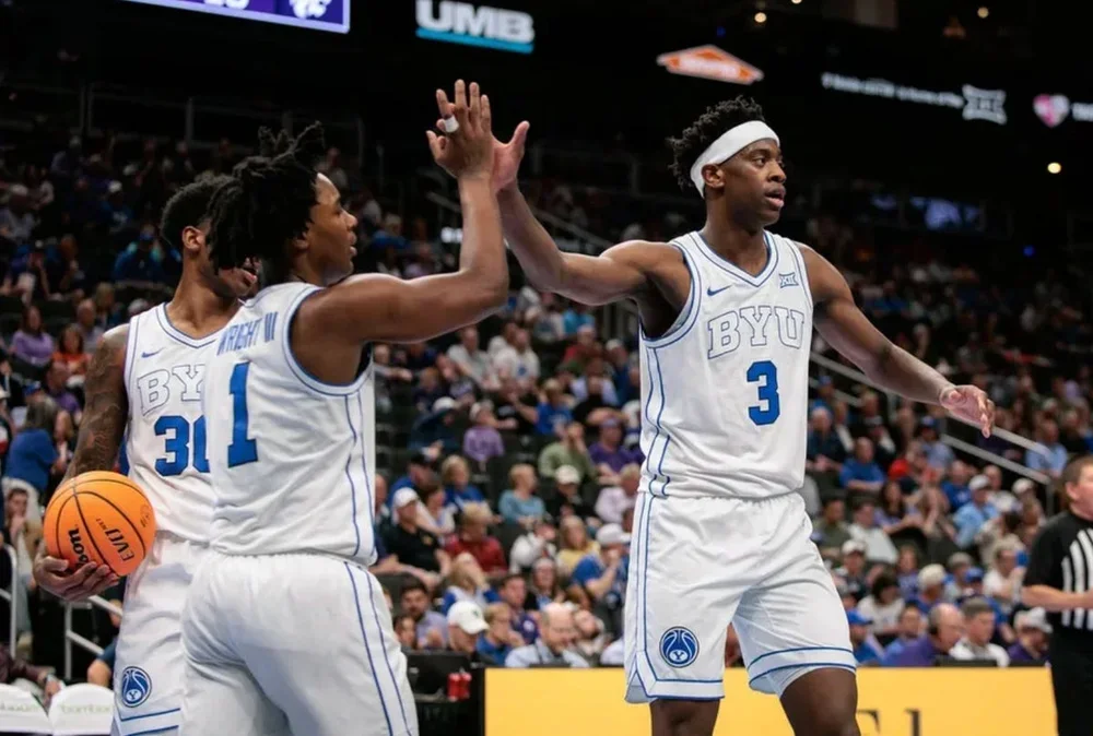 Mar 10, 2026; Kansas City, MO, USA; BYU Cougars forward AJ Dybantsa (3) slaps hands with BYU Cougars guard Robert Wright III (1) after a play during the second half against the Kansas State Wildcats at T-Mobile Center. Mandatory Credit: William Purnell-Imagn Images